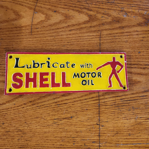 Shell cast iron sign.