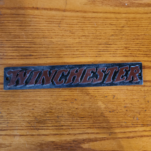 Winchester cast iron sign.