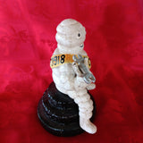 Michelin Figurine -Cast Iron  Michelin Man Sitting on Tire Advertising Piece