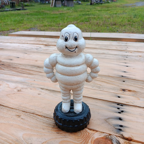 Michelin Man Standing on Tire Bank