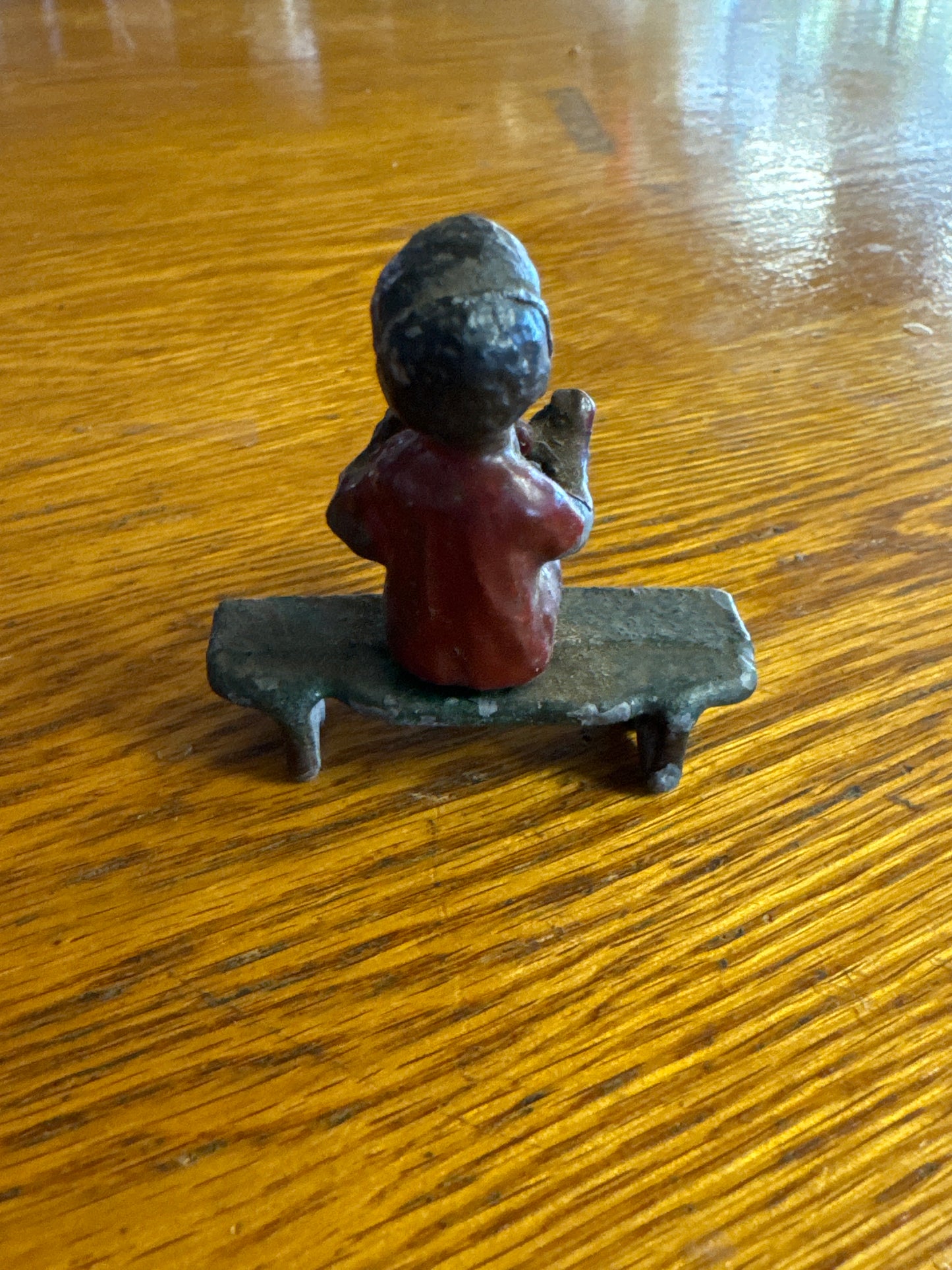 Lead Black Americana Boy Sitting on Bench