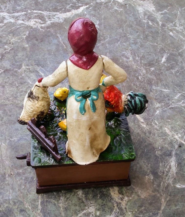 Cast Iron Mechanical Bank - Farm Woman Feeding Chickens Musical