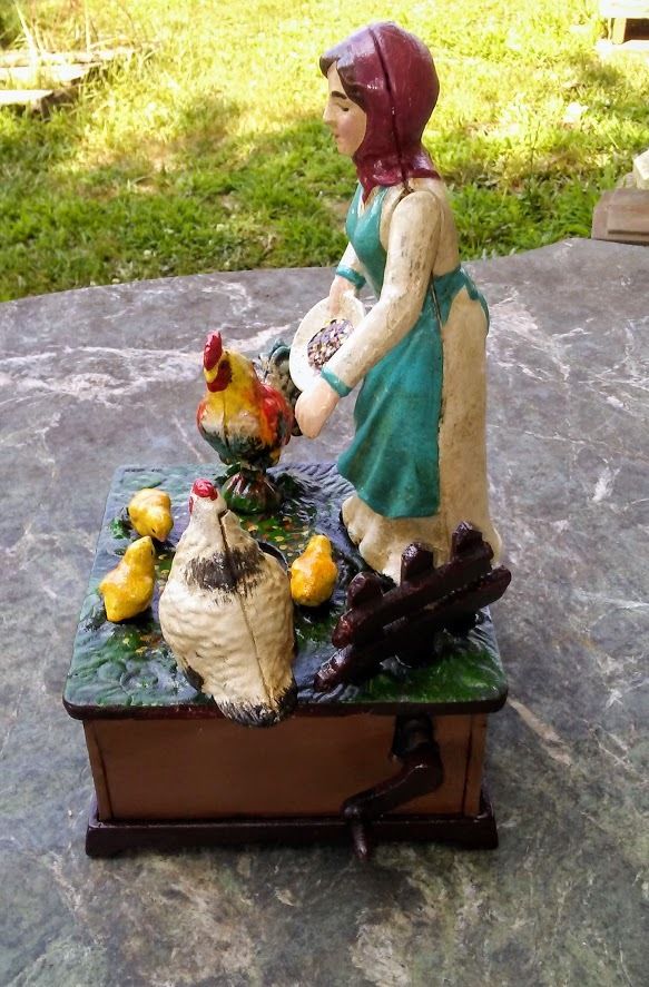 Cast Iron Mechanical Bank - Farm Woman Feeding Chickens Musical