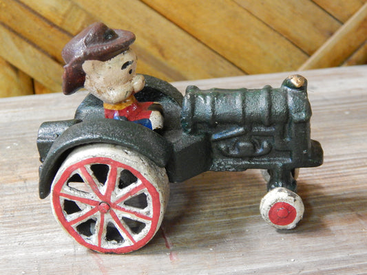 Cast Iron Figurine - Porky Pig on Farm Tractor