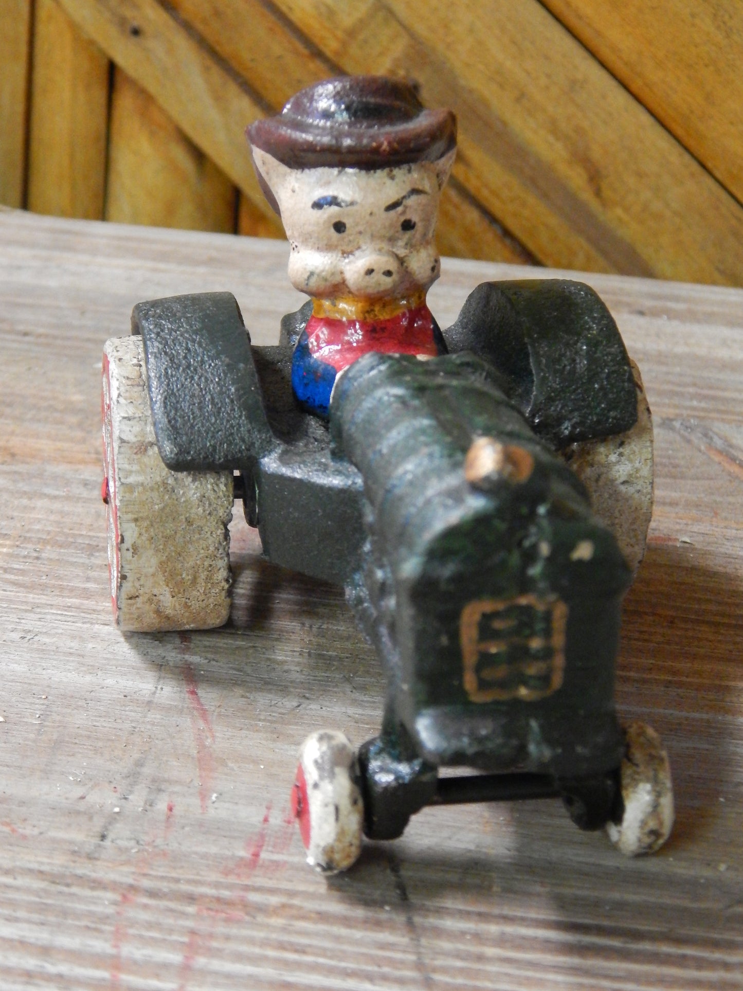 Cast Iron Figurine - Porky Pig on Farm Tractor