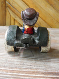 Cast Iron Figurine - Porky Pig on Farm Tractor