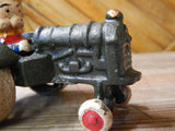 Cast Iron Figurine - Porky Pig on Farm Tractor