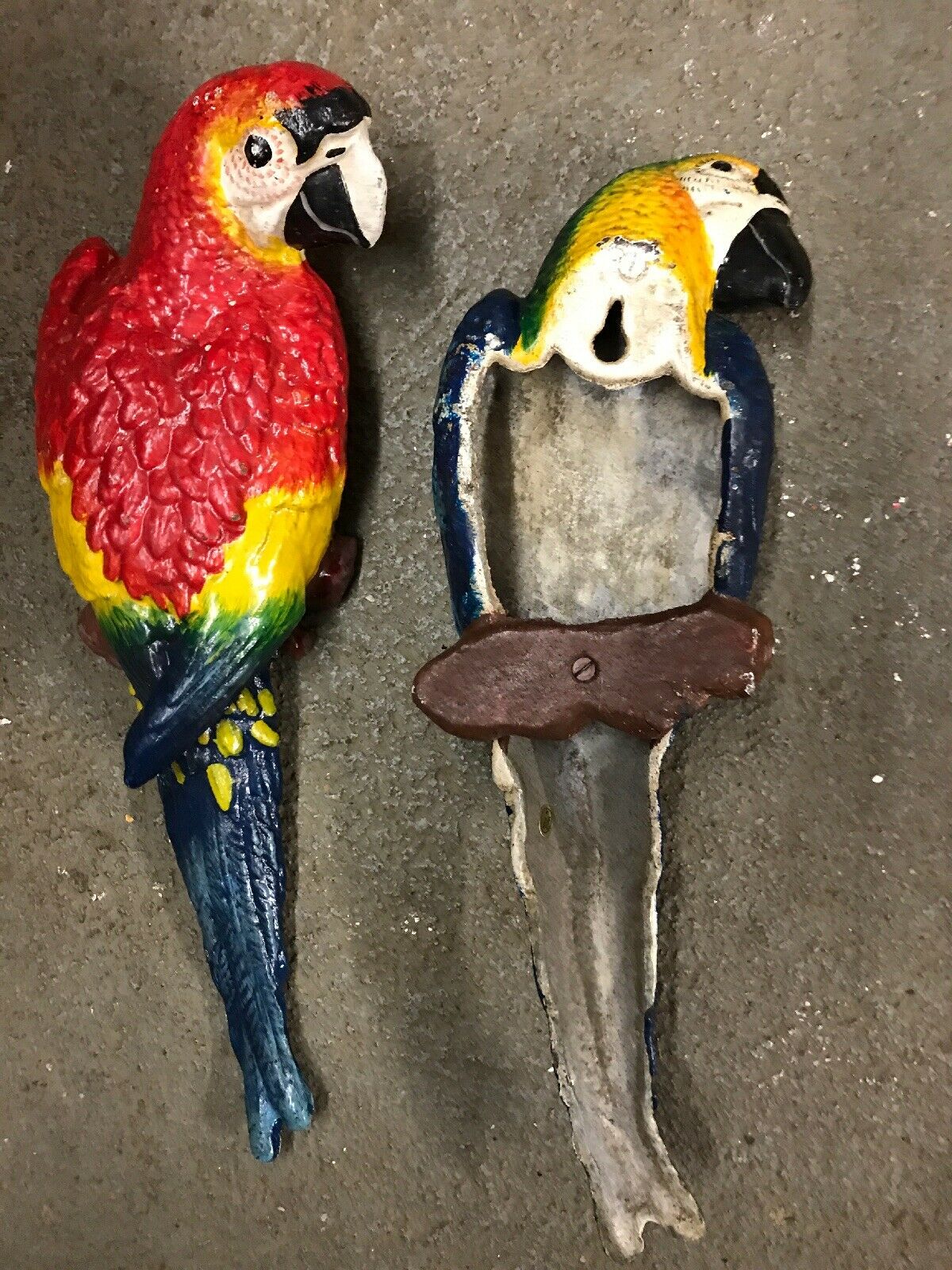 CAST IRON PAIR OF WALL MOUNT BLUE AND RED PARROT